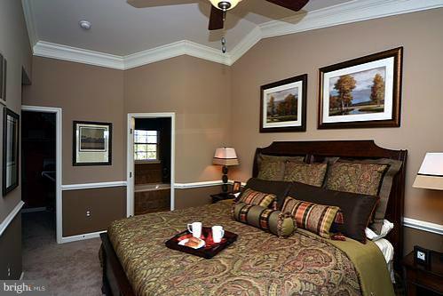 7332 Windsor Mill Road Baltimore, MD 21244 - Photo 7 of 19 a bedroom with a bed and wooden floor