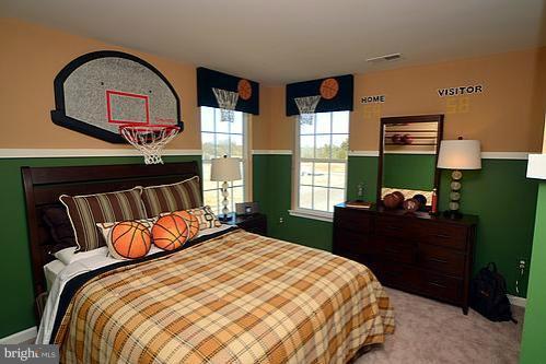 7332 Windsor Mill Road Baltimore, MD 21244 - Photo 8 of 19 a bedroom with a bed and window