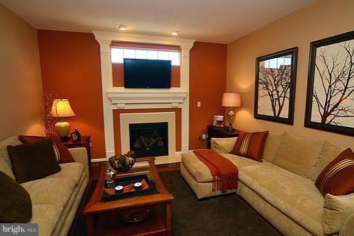 7332 Windsor Mill Road Baltimore, MD 21244 - Photo 10 of 19 a living room with furniture and a fireplace