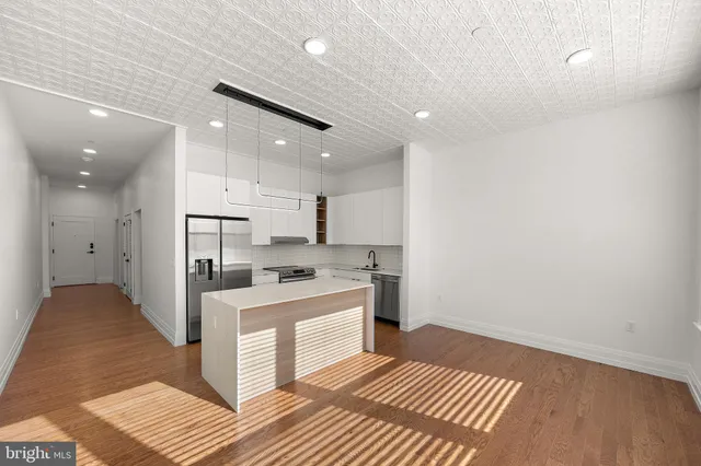 a view of a hallway with washer and dryer