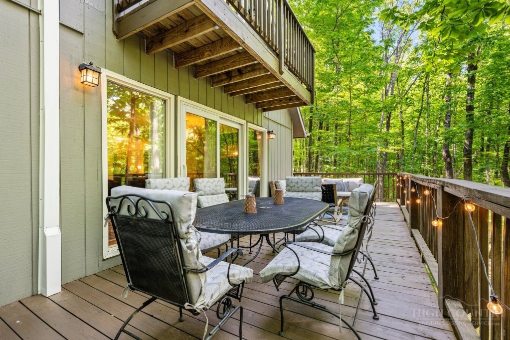 216 Saddle Lane Deep Gap, NC 28618 - Photo 27 of 44 a view of a patio with a table and chairs