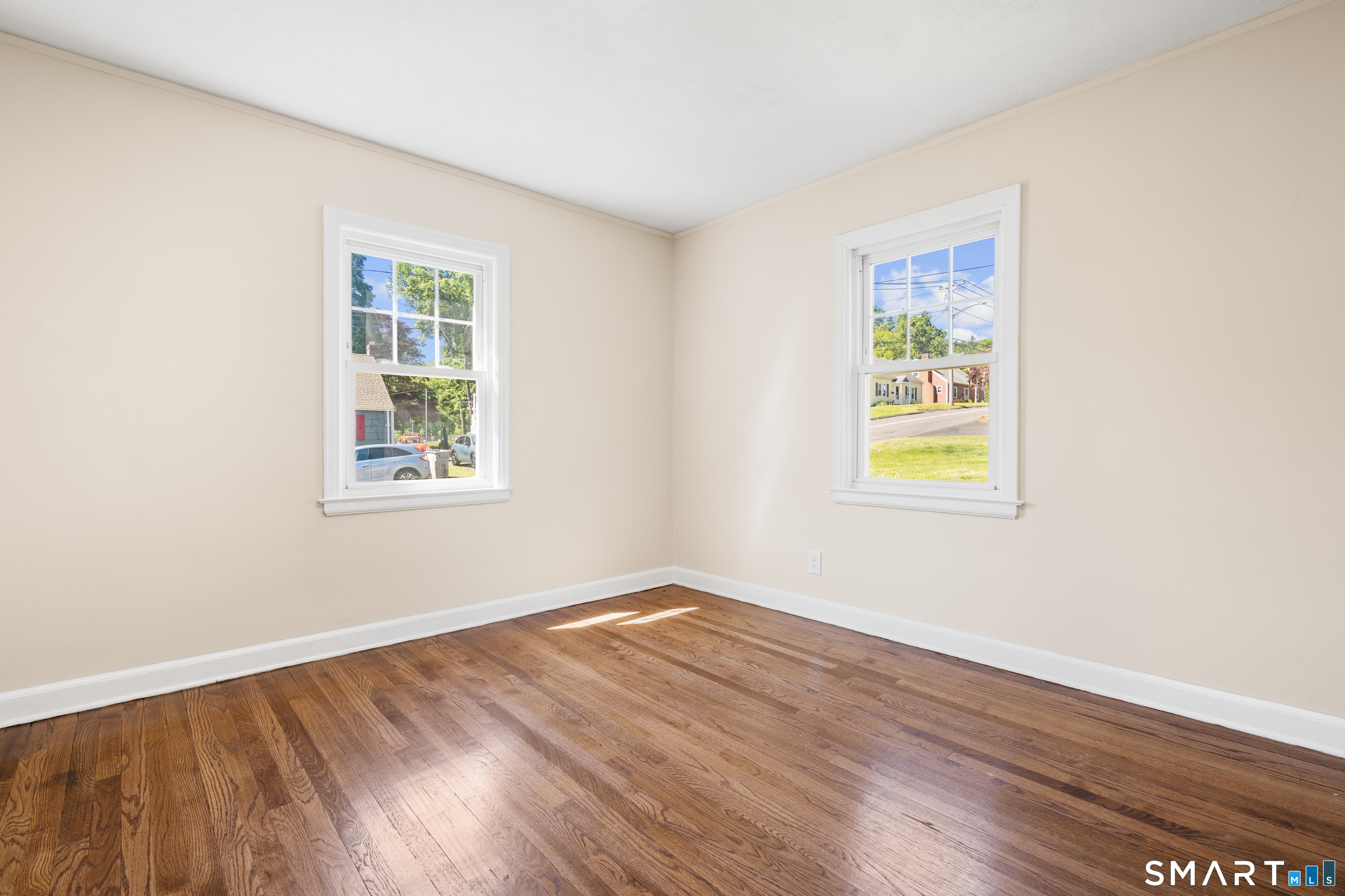 175 Moody Street Bristol, CT 06010 - Photo 19 of 28 wooden floor in an empty room with a window