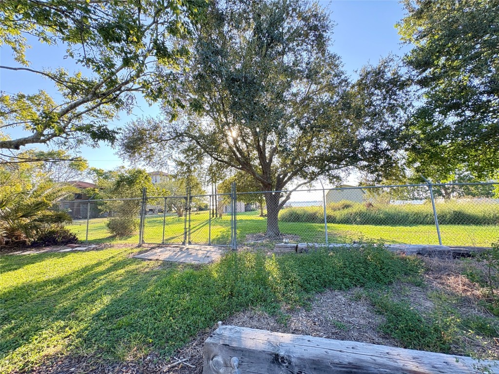 182 Smith Road Palacios, TX 77465 - Photo 20 of 26 a view of a swimming pool with an outdoor space and seating area