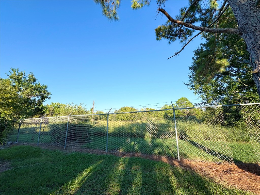 182 Smith Road Palacios, TX 77465 - Photo 25 of 26 a view of a lake with a yard