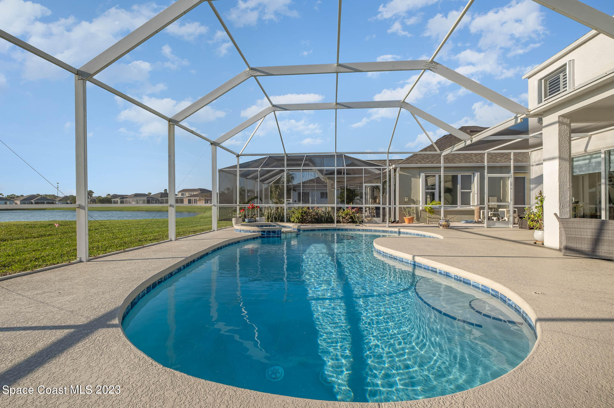 3032 Jacobaeus Lane Indialantic, FL 32903 - Photo 1 of 43 a view of a swimming pool with an outdoor seating