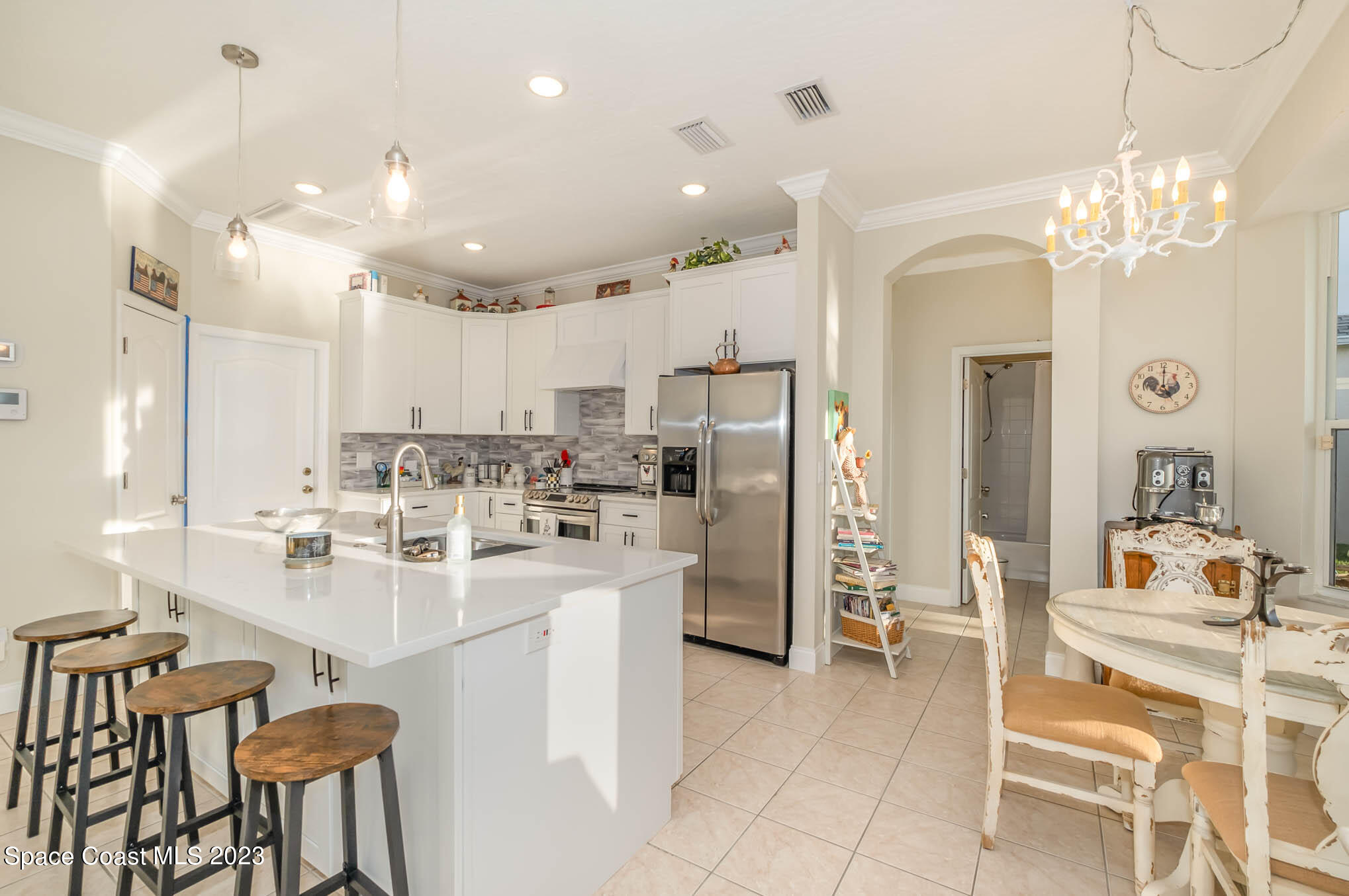 3032 Jacobaeus Lane Indialantic, FL 32903 - Photo 12 of 43 a kitchen with refrigerator and cabinets