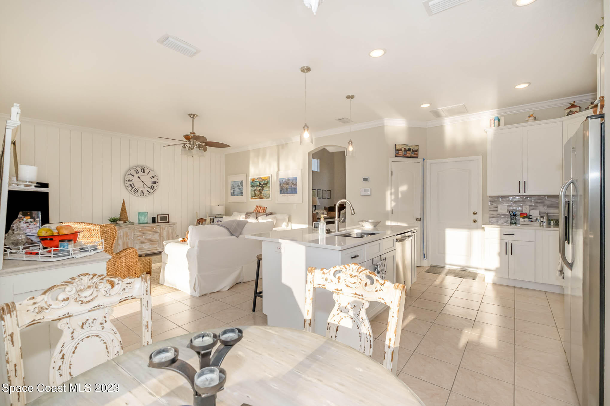 3032 Jacobaeus Lane Indialantic, FL 32903 - Photo 13 of 43 a large white kitchen with a large window and stainless steel appliances