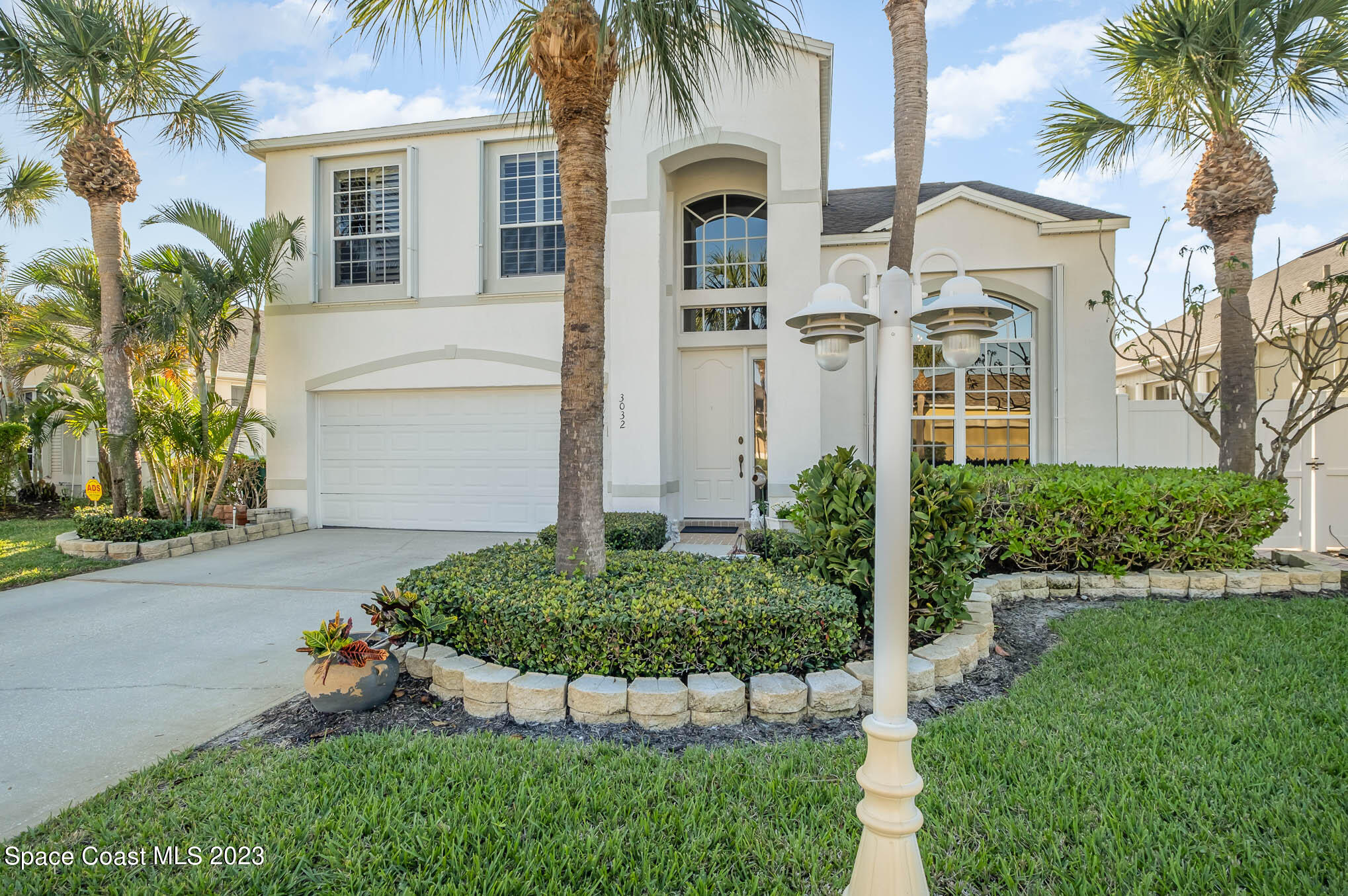 3032 Jacobaeus Lane Indialantic, FL 32903 - Photo 2 of 43 front view of a house with a yard