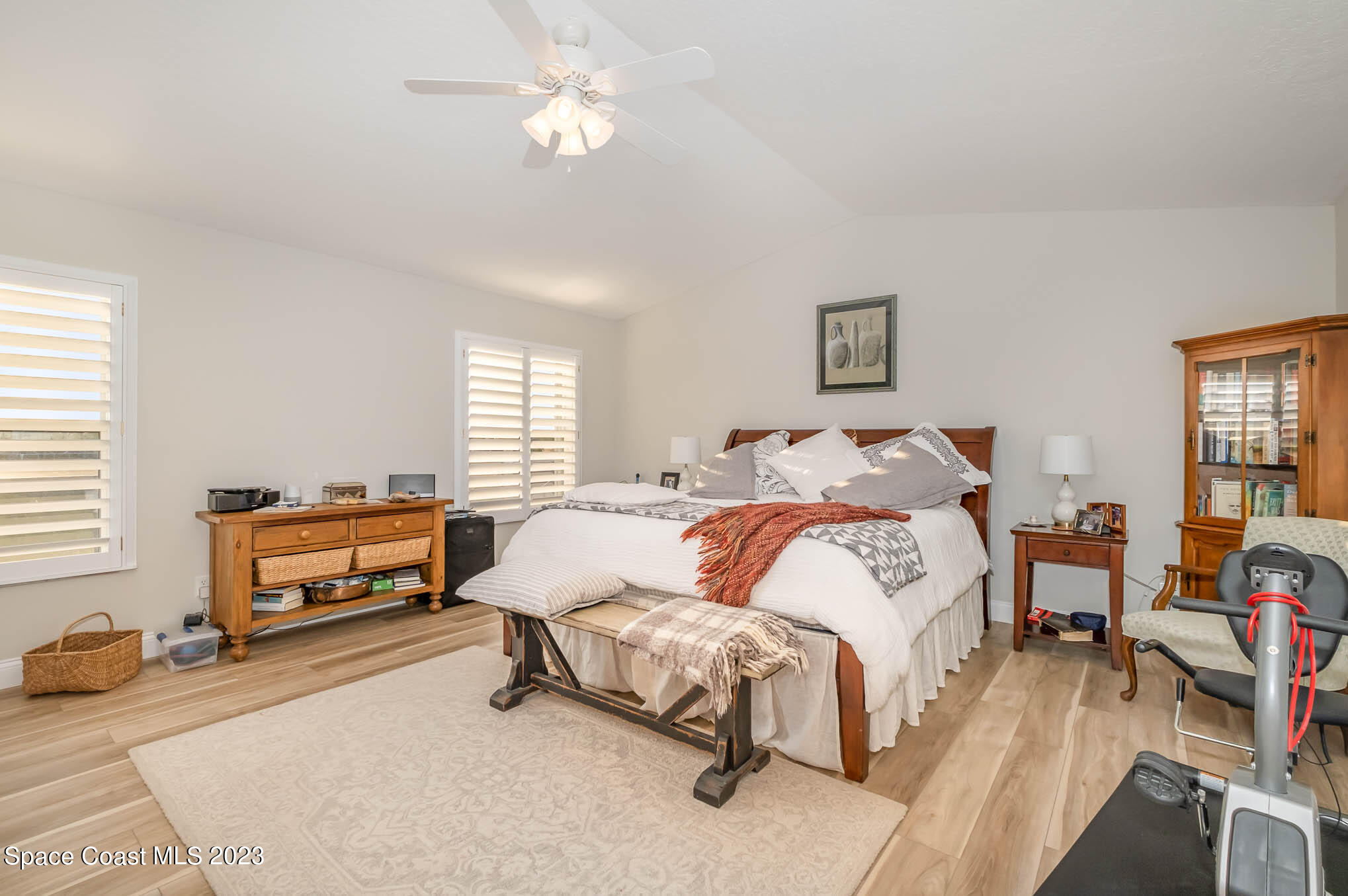 3032 Jacobaeus Lane Indialantic, FL 32903 - Photo 21 of 43 a bedroom with a bed and a chandelier