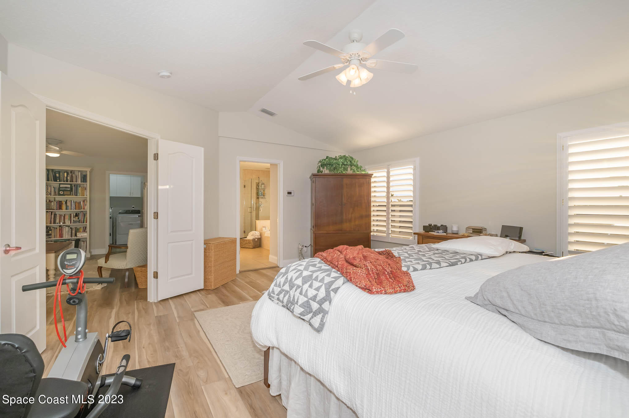 3032 Jacobaeus Lane Indialantic, FL 32903 - Photo 22 of 43 a bedroom with a bed and dresser with mirror