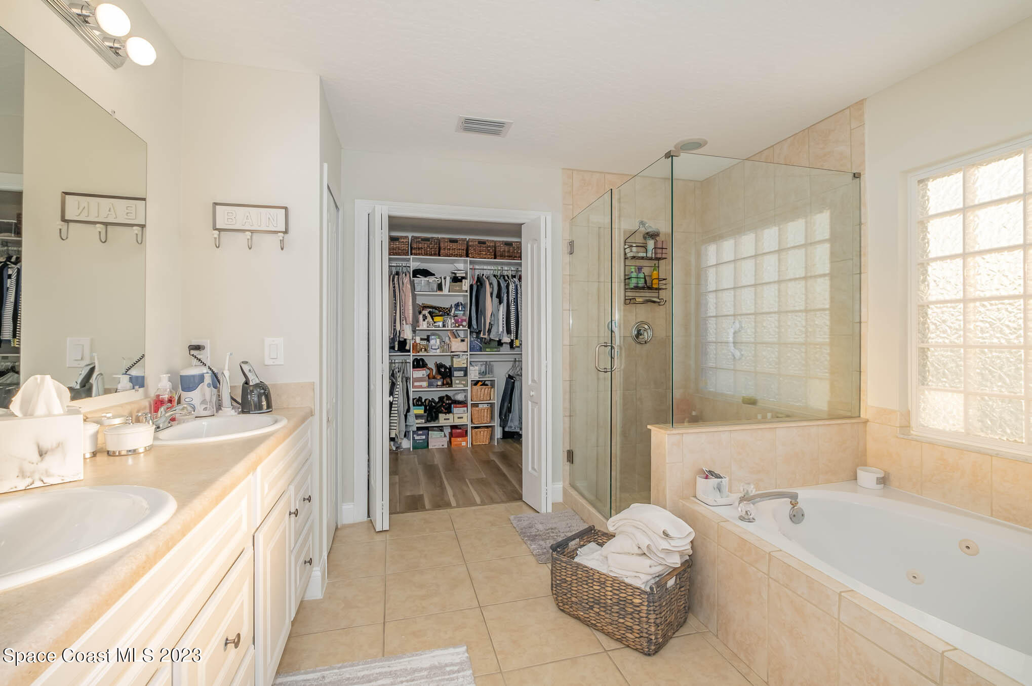 3032 Jacobaeus Lane Indialantic, FL 32903 - Photo 24 of 43 a bathroom with a tub sink and shower