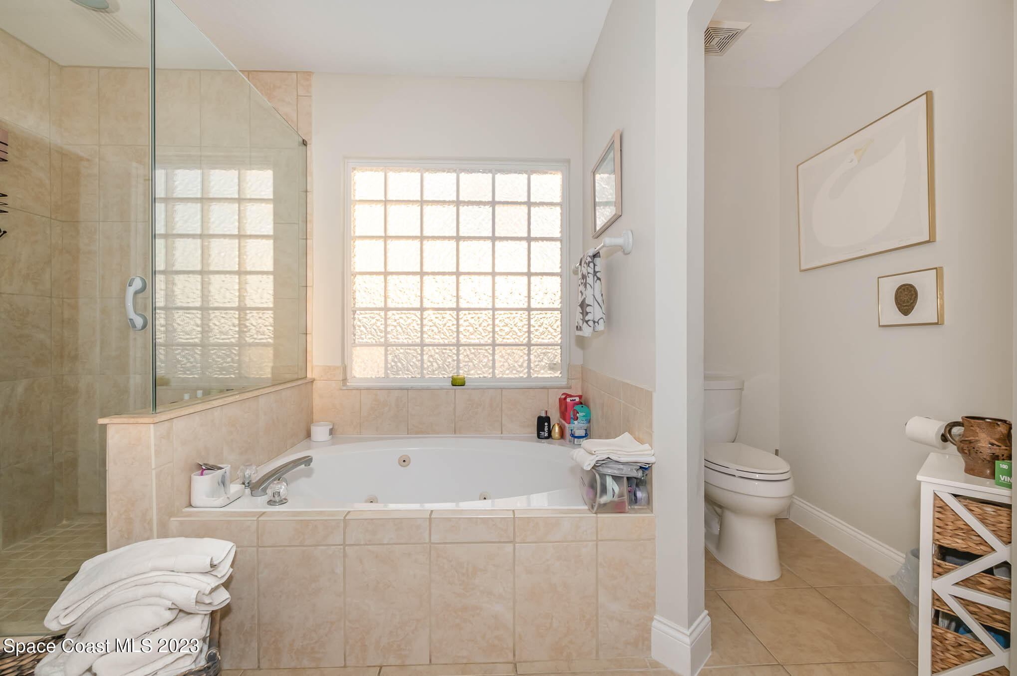 3032 Jacobaeus Lane Indialantic, FL 32903 - Photo 25 of 43 a bath room with a toilet and a bath tub