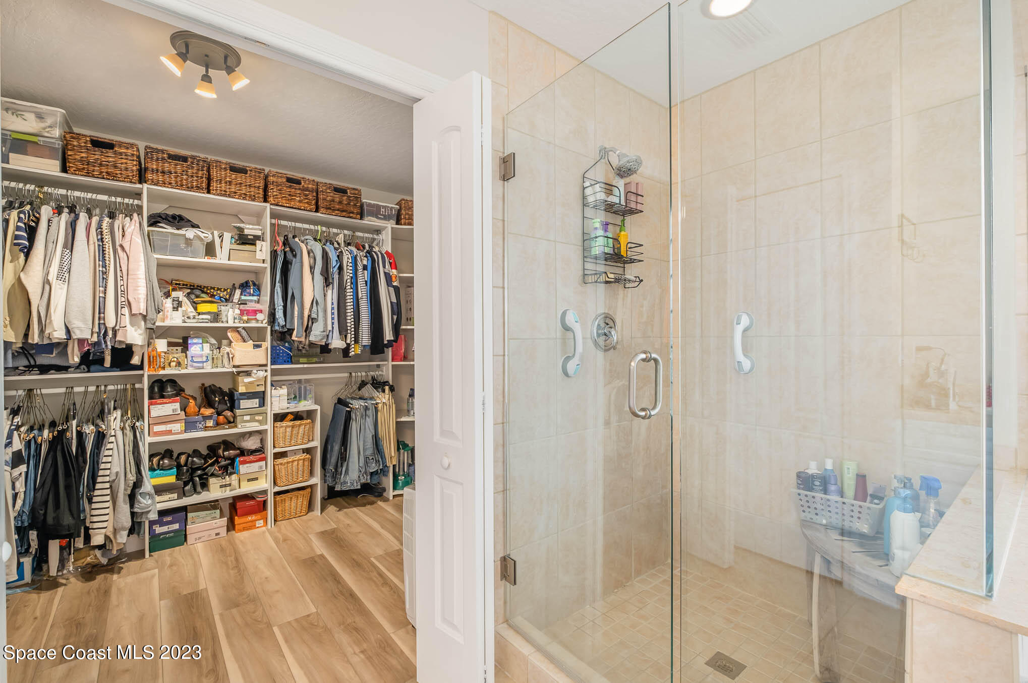 3032 Jacobaeus Lane Indialantic, FL 32903 - Photo 26 of 43 a view of a walk in closet with clothes and shoes