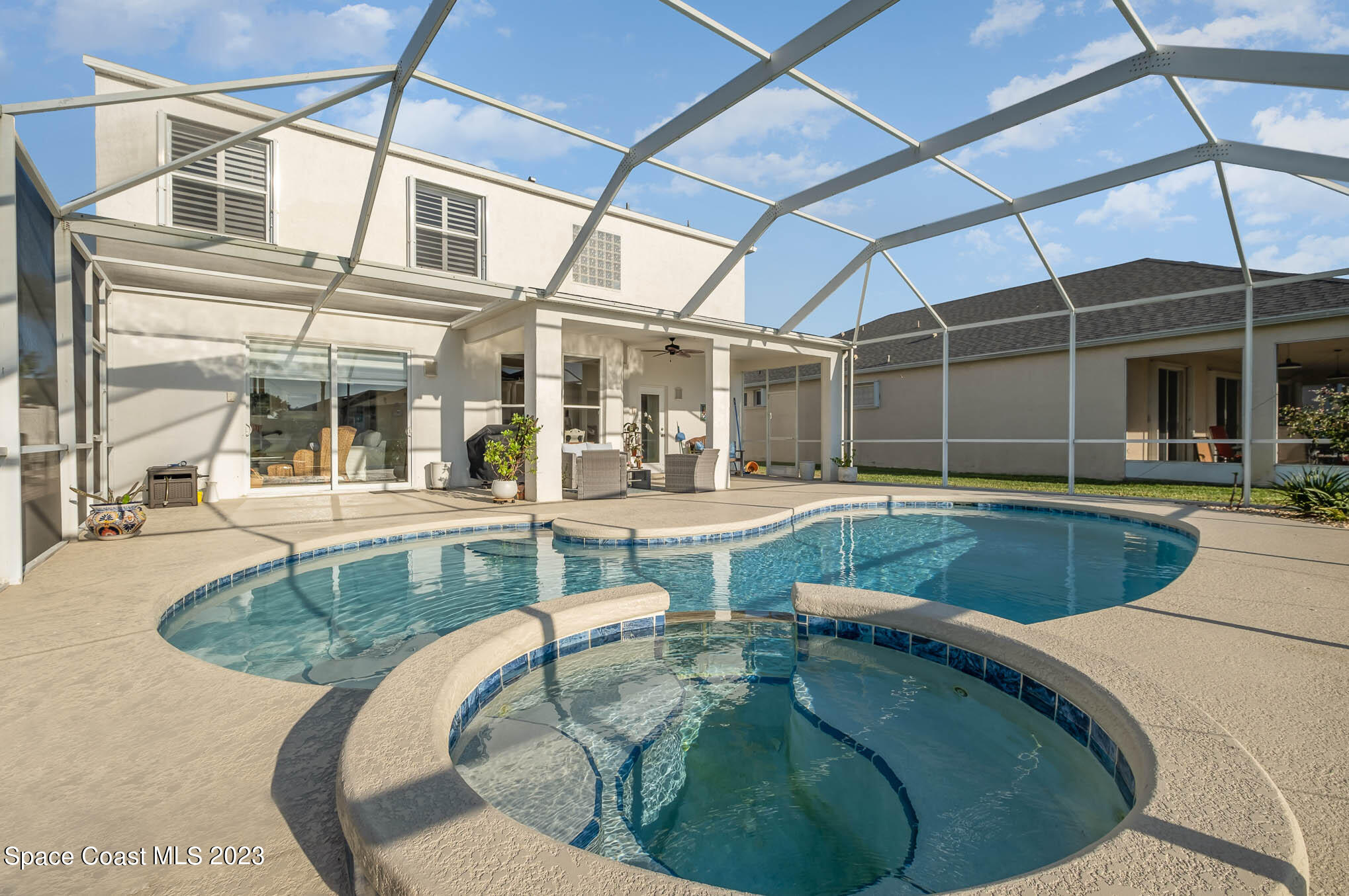 3032 Jacobaeus Lane Indialantic, FL 32903 - Photo 33 of 43 a view of a swimming pool with outdoor seating
