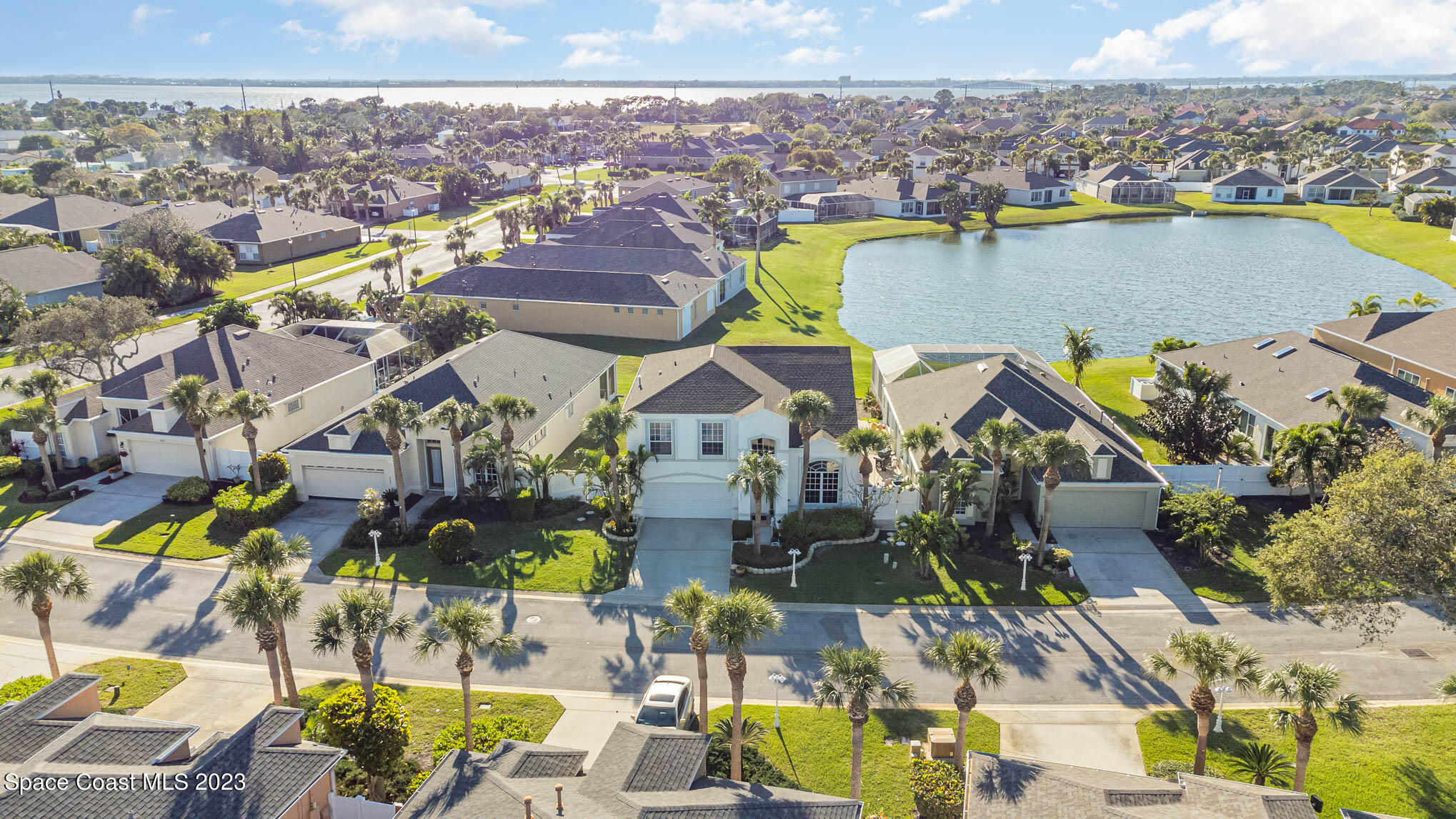 3032 Jacobaeus Lane Indialantic, FL 32903 - Photo 38 of 43 an aerial view of residential houses with outdoor space and swimming pool