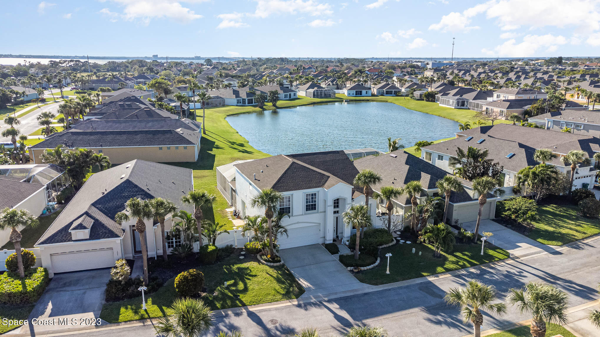 3032 Jacobaeus Lane Indialantic, FL 32903 - Photo 39 of 43 an aerial view of a house with a swimming pool outdoor seating and yard
