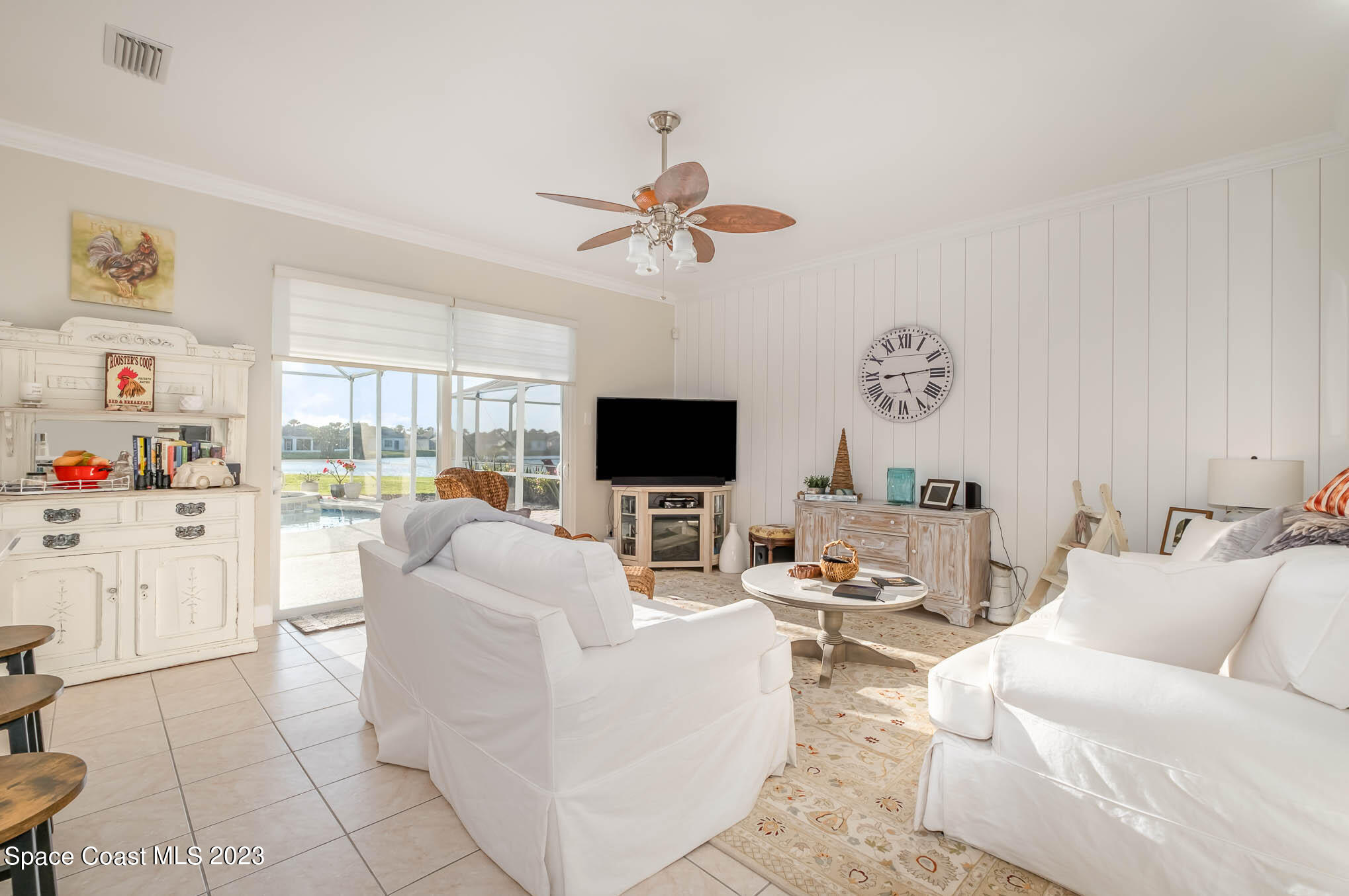 3032 Jacobaeus Lane Indialantic, FL 32903 - Photo 8 of 43 a living room with furniture fireplace and a flat screen tv