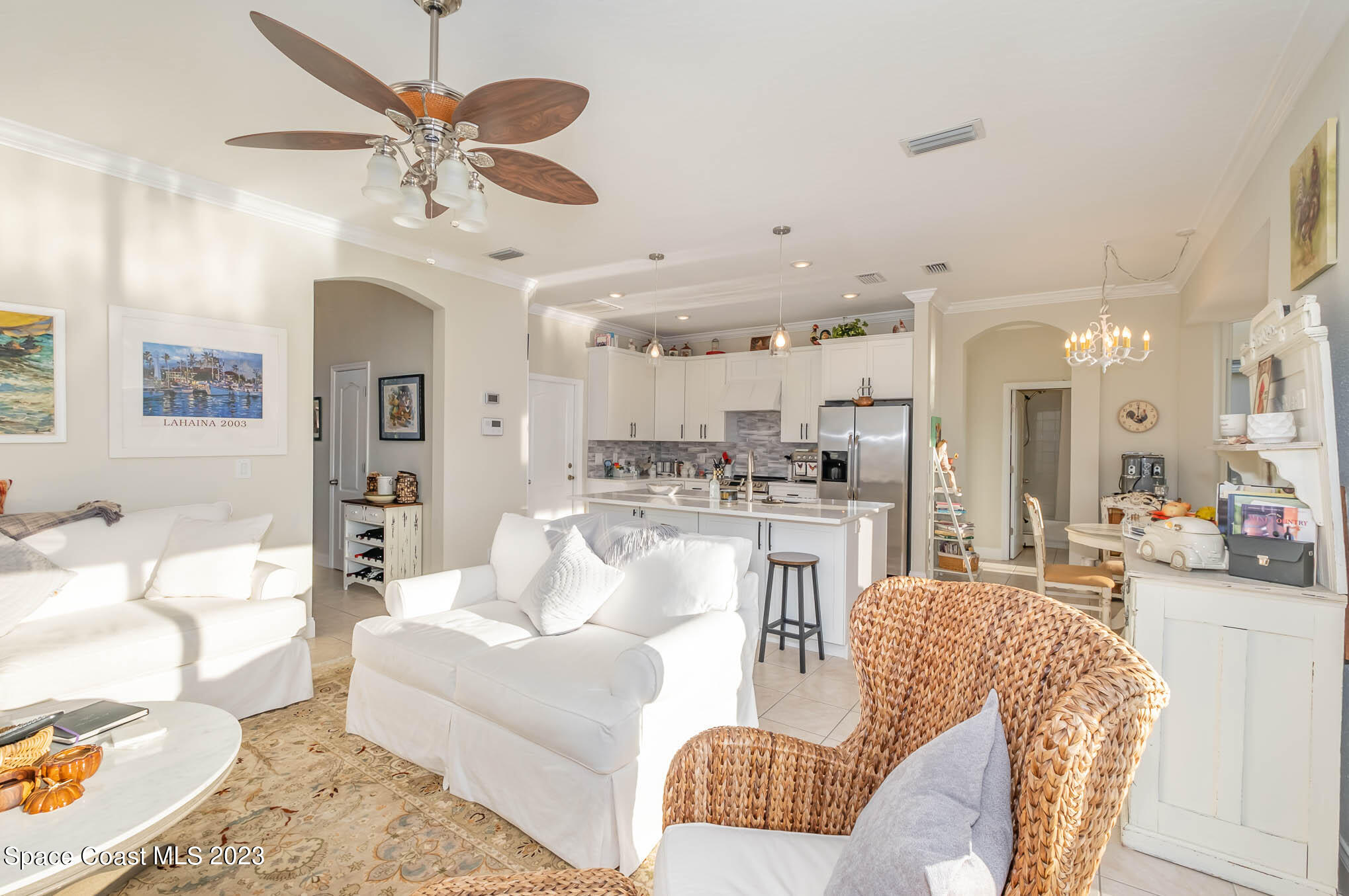3032 Jacobaeus Lane Indialantic, FL 32903 - Photo 10 of 43 a living room with furniture kitchen view and a chandelier