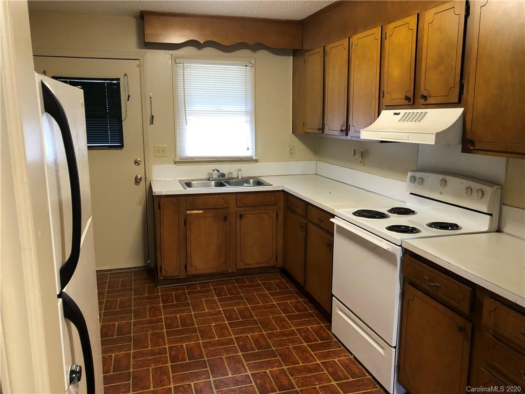121 Massapoag Road Lincolnton, NC 28092 - Photo 3 of 6 a kitchen that has a sink a stove and a refrigerator