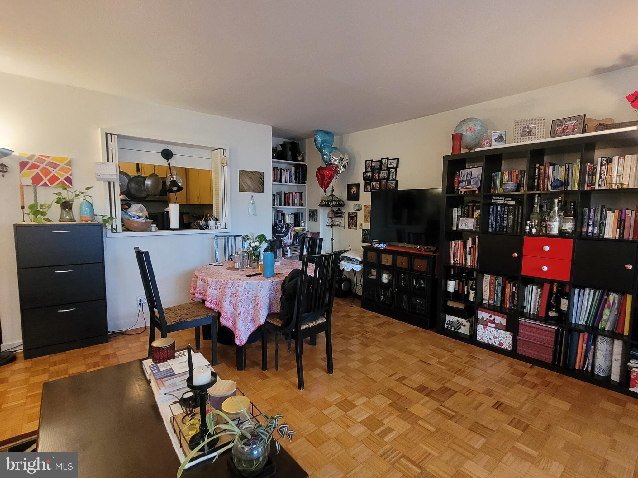 224 West Rittenhouse Square, Unit 413 Philadelphia, PA 19103 - Photo 3 of 25 a view of a dining room with furniture and a book shelf