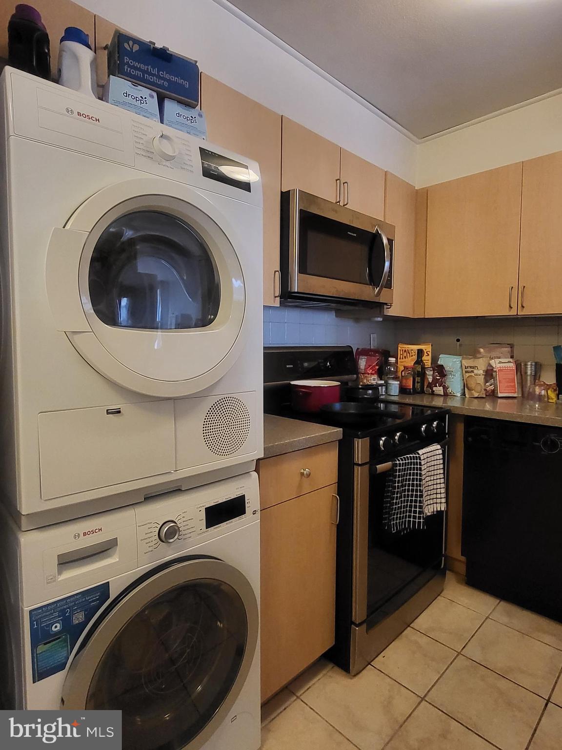 224 West Rittenhouse Square, Unit 413 Philadelphia, PA 19103 - Photo 5 of 25 a kitchen with stainless steel appliances granite countertop a sink a stove and cabinets