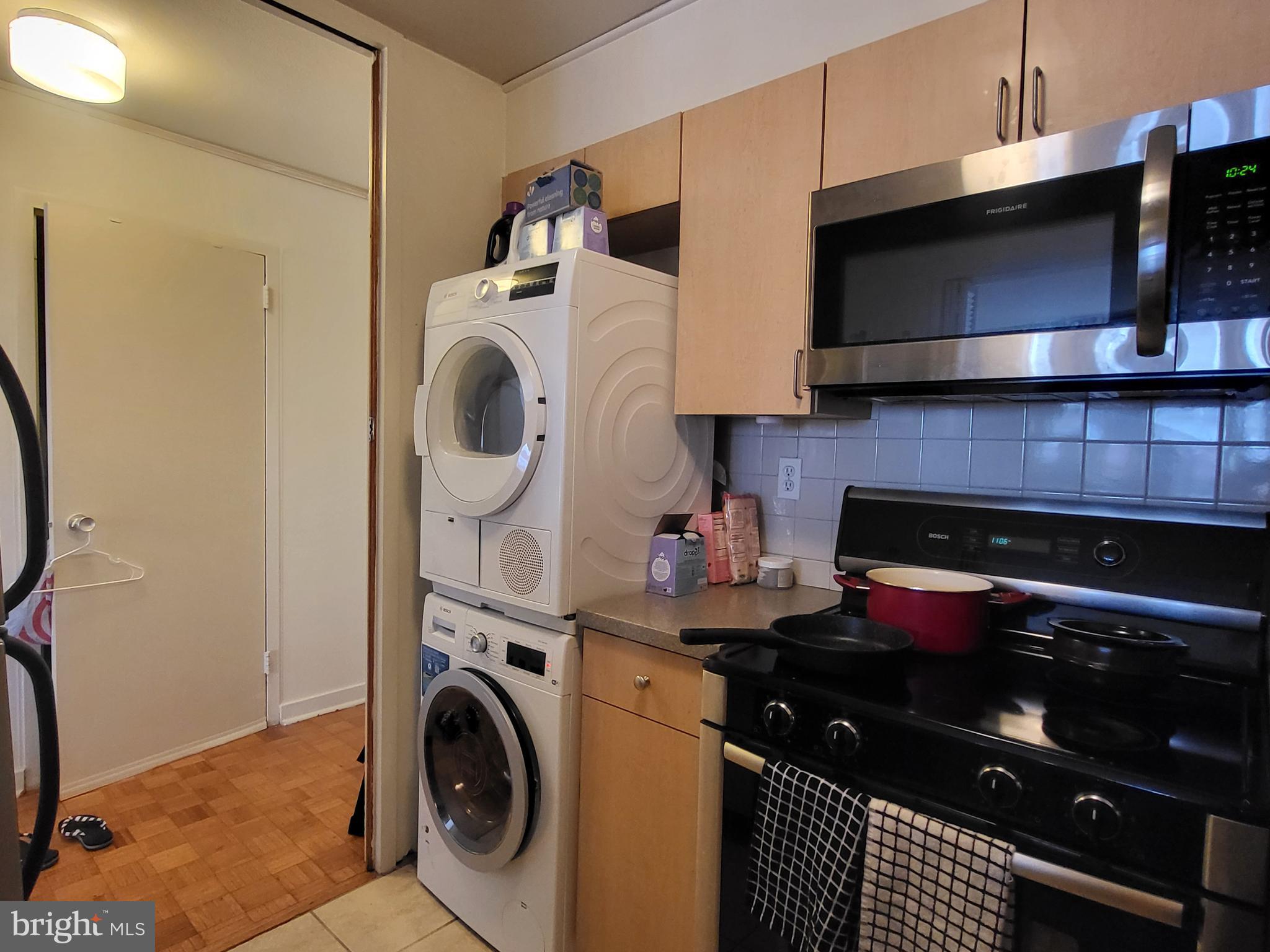 224 West Rittenhouse Square, Unit 413 Philadelphia, PA 19103 - Photo 7 of 25 a kitchen with a stove and a microwave