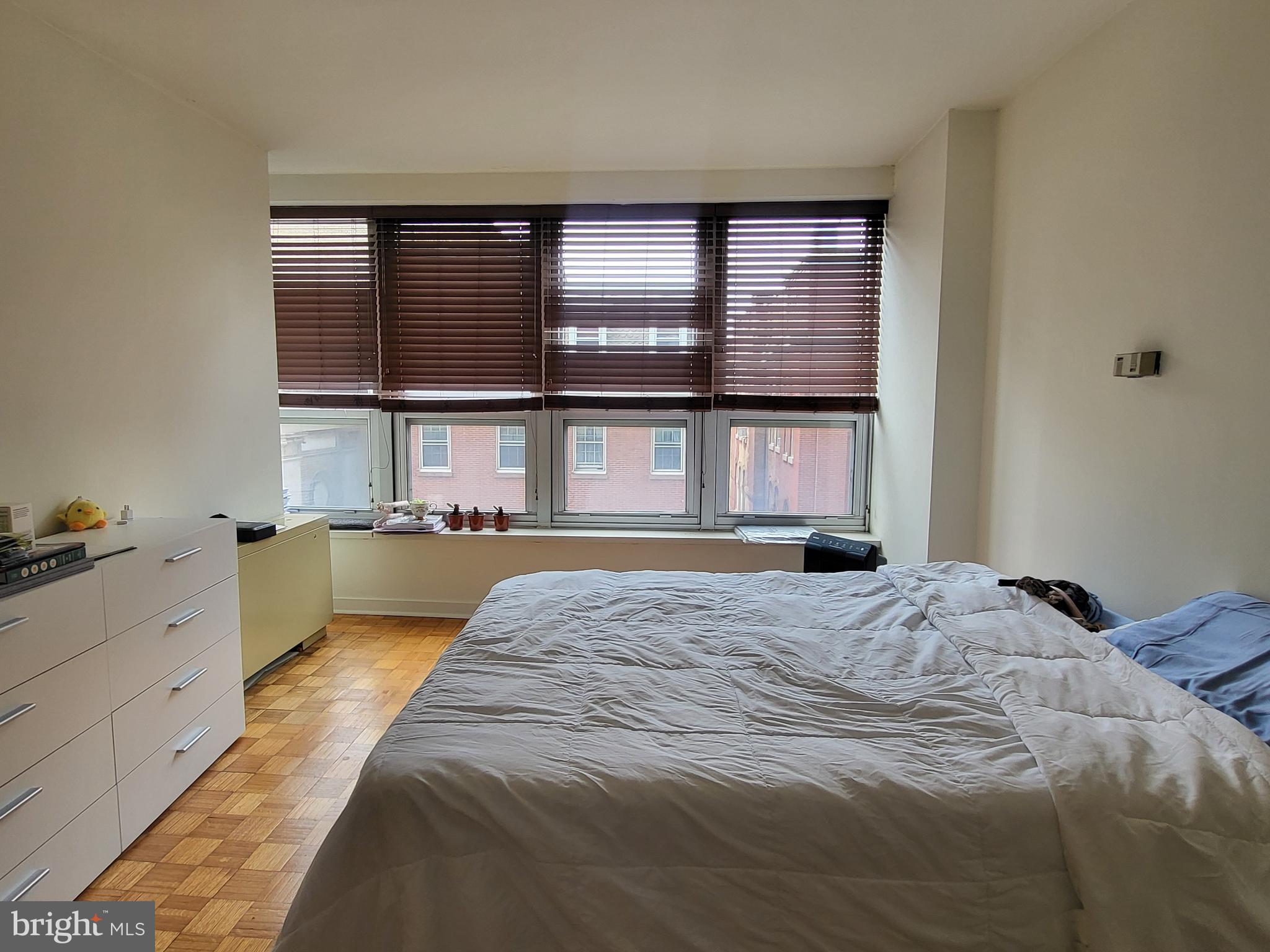 224 West Rittenhouse Square, Unit 413 Philadelphia, PA 19103 - Photo 9 of 25 a spacious bedroom with a large bed and a large window