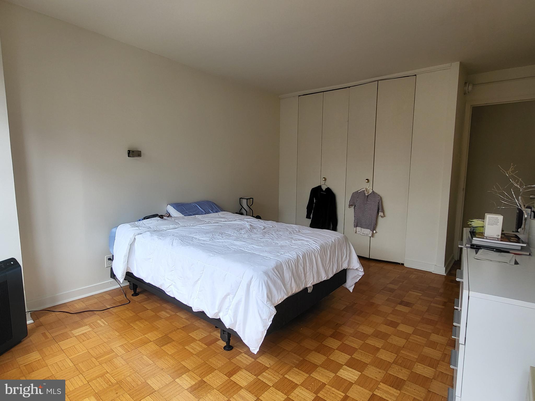 224 West Rittenhouse Square, Unit 413 Philadelphia, PA 19103 - Photo 10 of 25 a bedroom with a bed and a flat screen tv