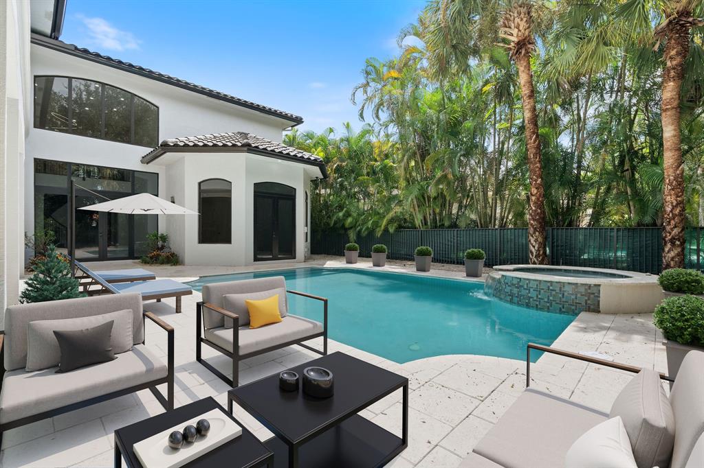 17935 Monte Vista Drive Boca Raton, FL 33496 - Photo 11 of 60 a view of a patio with couches and a table and chairs with garden view