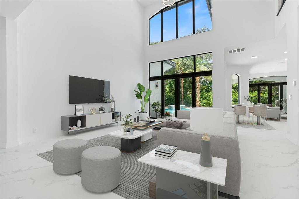 17935 Monte Vista Drive Boca Raton, FL 33496 - Photo 14 of 60 a living room with furniture and a flat screen tv
