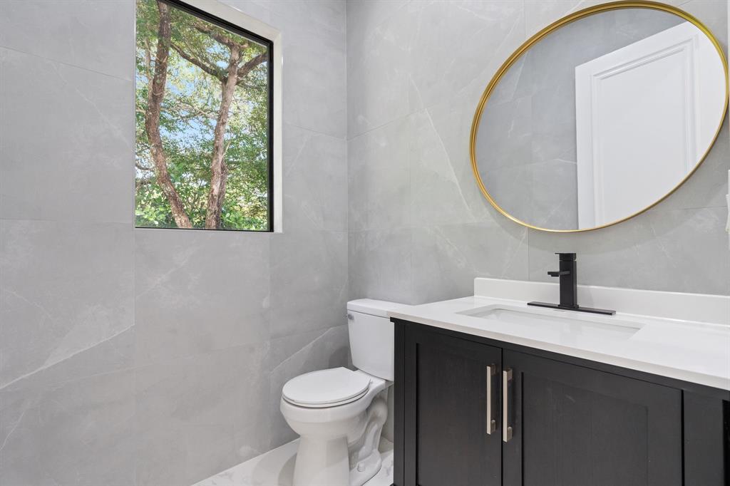 17935 Monte Vista Drive Boca Raton, FL 33496 - Photo 26 of 60 a bathroom with a sink a toilet and a mirror