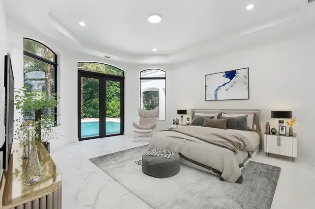 a spacious bathroom with a granite countertop sink mirror and bathtub