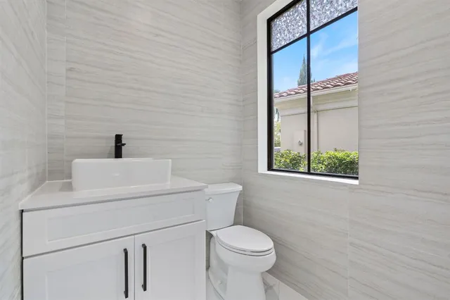 a utility room with sink dryer and washer