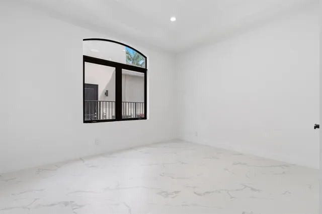 a bathroom with a glass shower door
