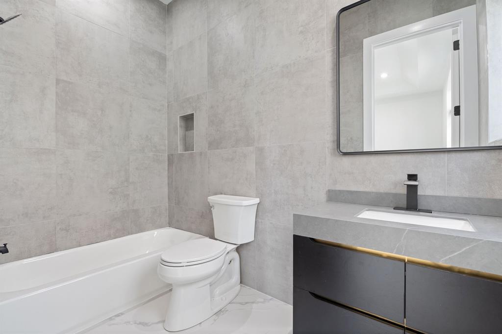 17935 Monte Vista Drive Boca Raton, FL 33496 - Photo 37 of 60 a bathroom with a granite countertop sink a toilet and a mirror