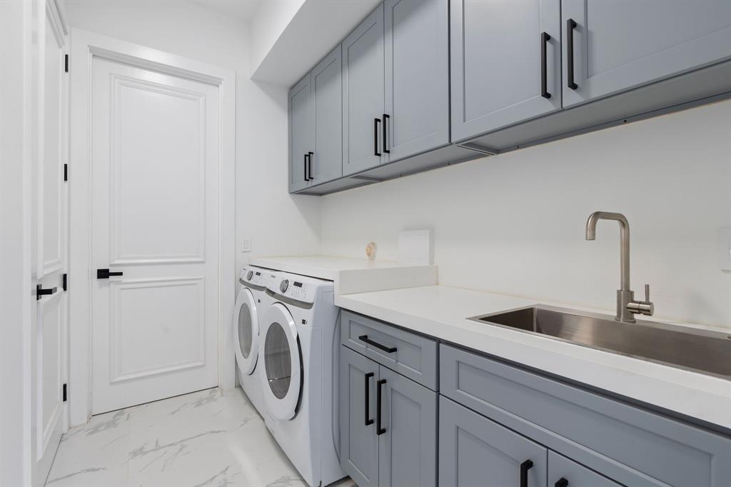 17935 Monte Vista Drive Boca Raton, FL 33496 - Photo 38 of 60 a utility room with sink dryer and washer