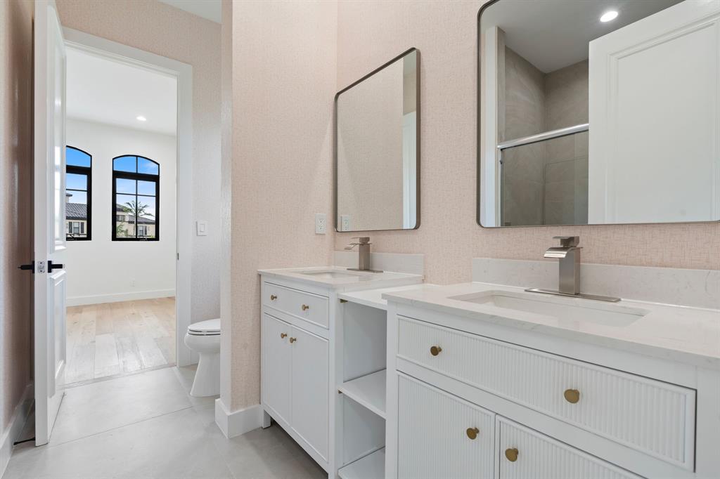 17935 Monte Vista Drive Boca Raton, FL 33496 - Photo 41 of 60 a bathroom with a double vanity sink and mirror