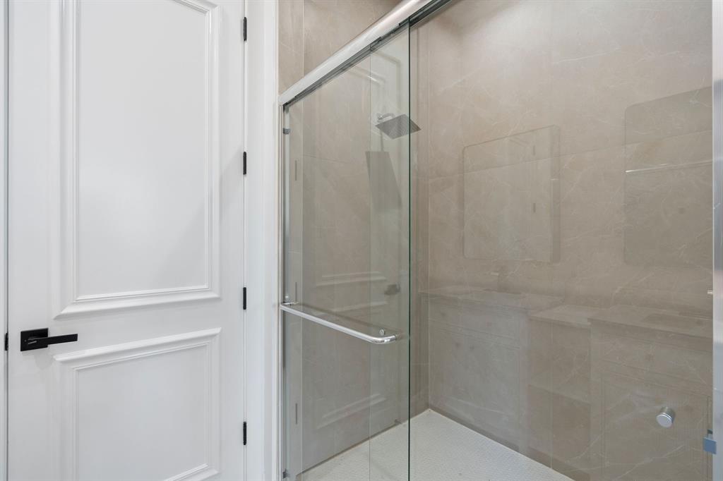 17935 Monte Vista Drive Boca Raton, FL 33496 - Photo 42 of 60 a bathroom with a glass shower door