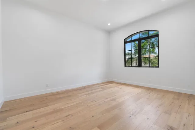 a view of an empty room with glass door