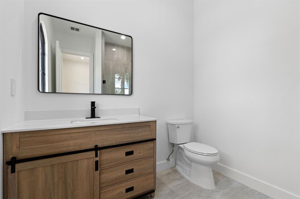 17935 Monte Vista Drive Boca Raton, FL 33496 - Photo 45 of 60 a bathroom with a toilet sink and mirror