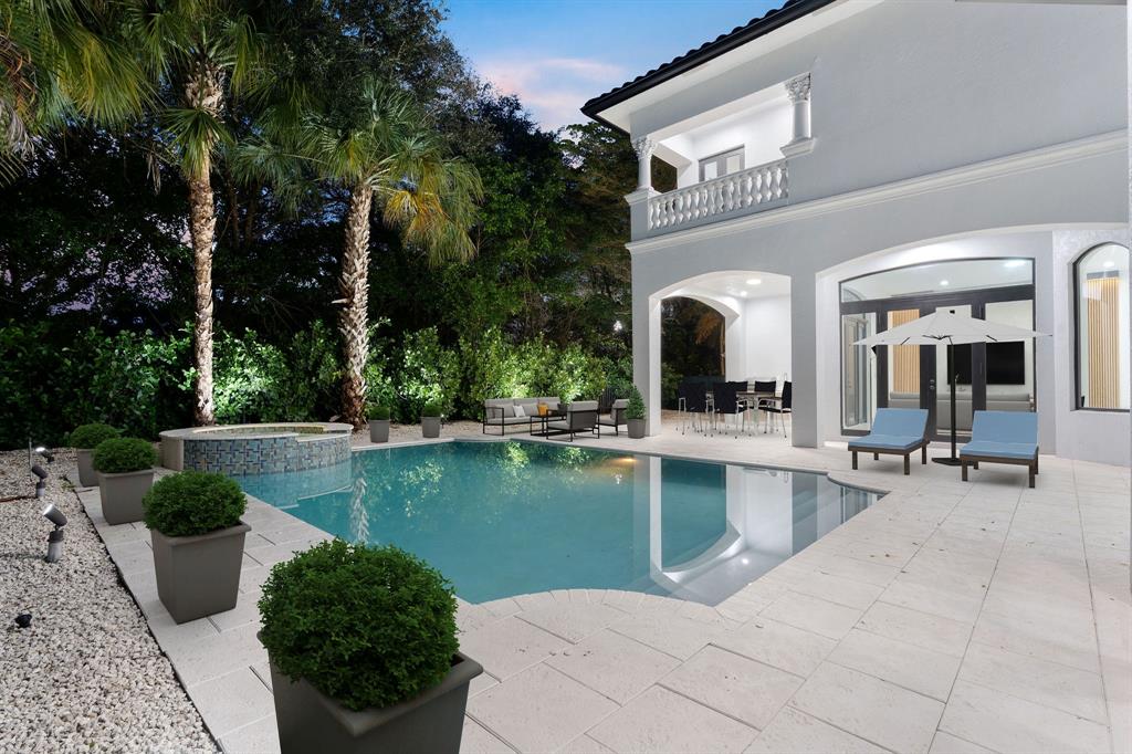 17935 Monte Vista Drive Boca Raton, FL 33496 - Photo 57 of 60 a view of a swimming pool with outdoor seating and plants
