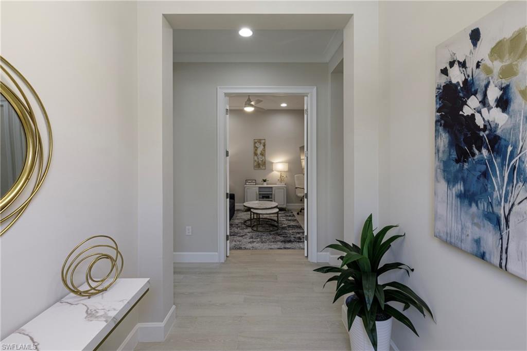 8909 Yucatan Court Naples, FL 34113 - Photo 2 of 36 Corridor with light wood-type flooring and recessed lighting