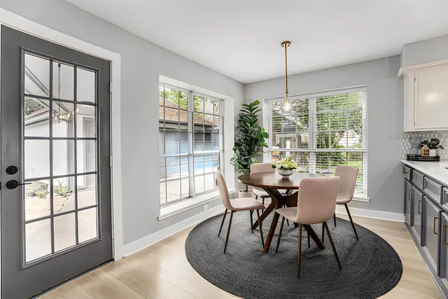 a dining room with furniture window wooden floor