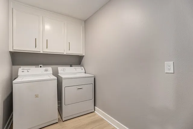 a view of storage and utility room with washer and dryer