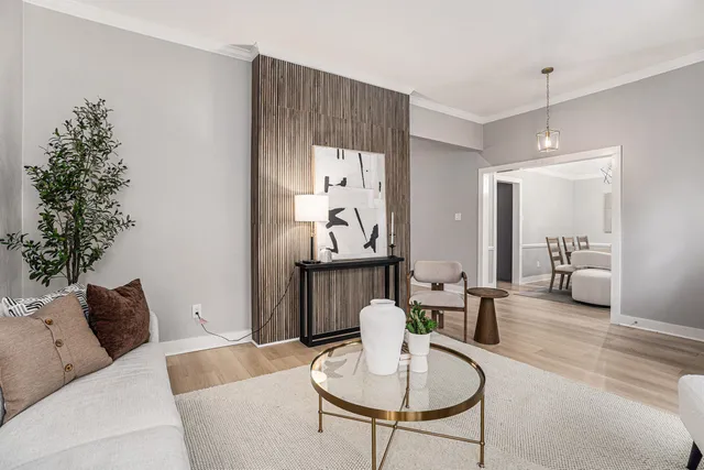 a living room with furniture and a table