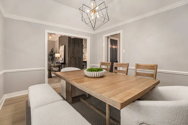 a dining room with a table and chairs