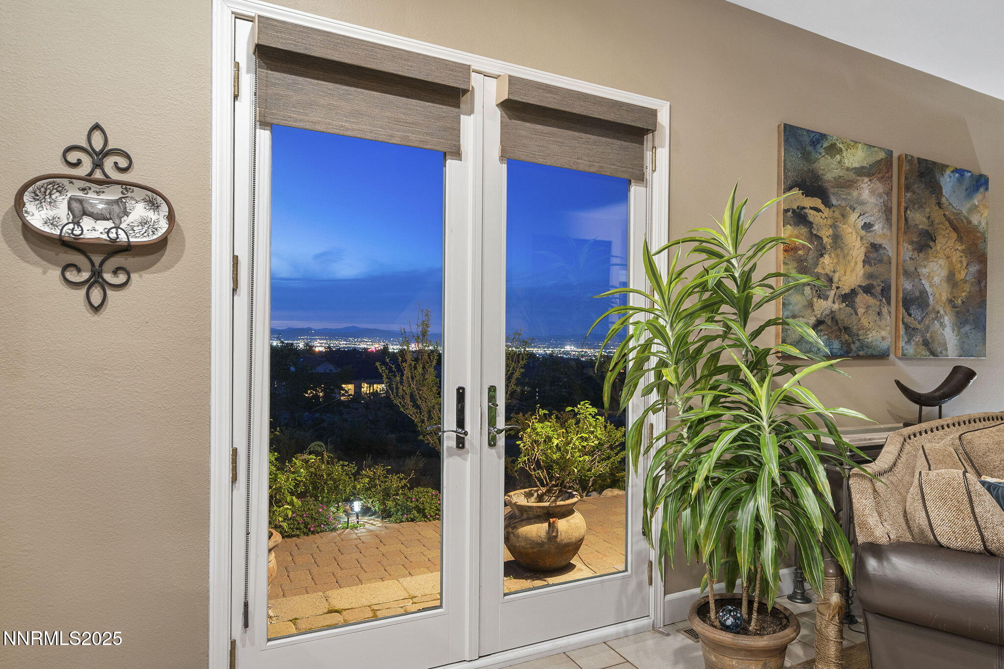 2698 Wind Feather Trail Reno, NV 89511 - Photo 16 of 44 a vase of flowers sitting on a table near a window
