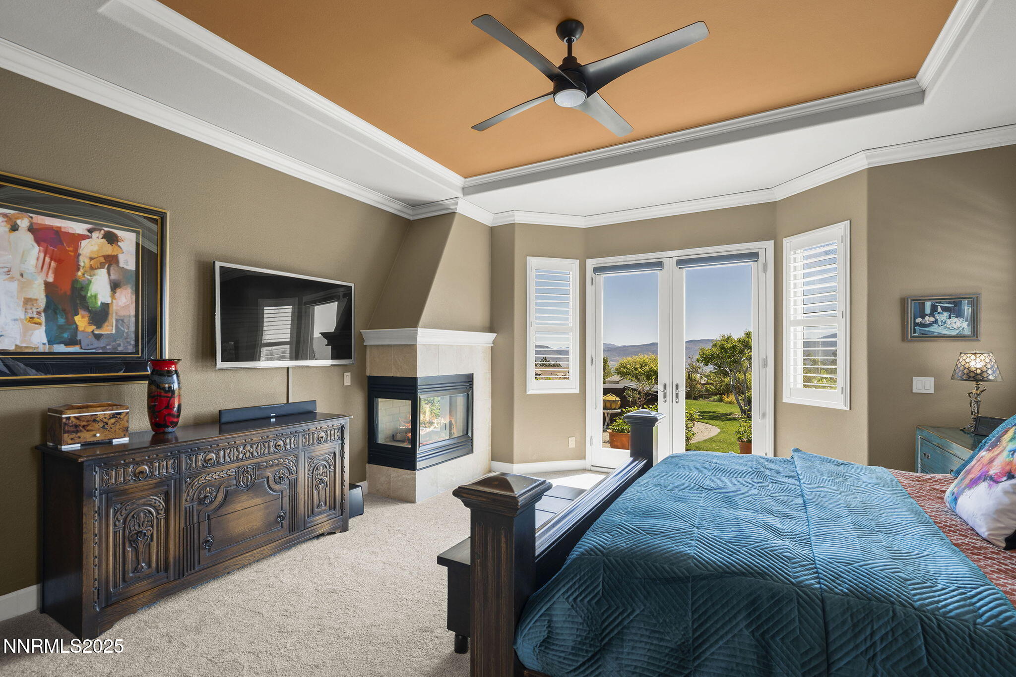 2698 Wind Feather Trail Reno, NV 89511 - Photo 17 of 44 a bedroom with a bed and a flat screen tv