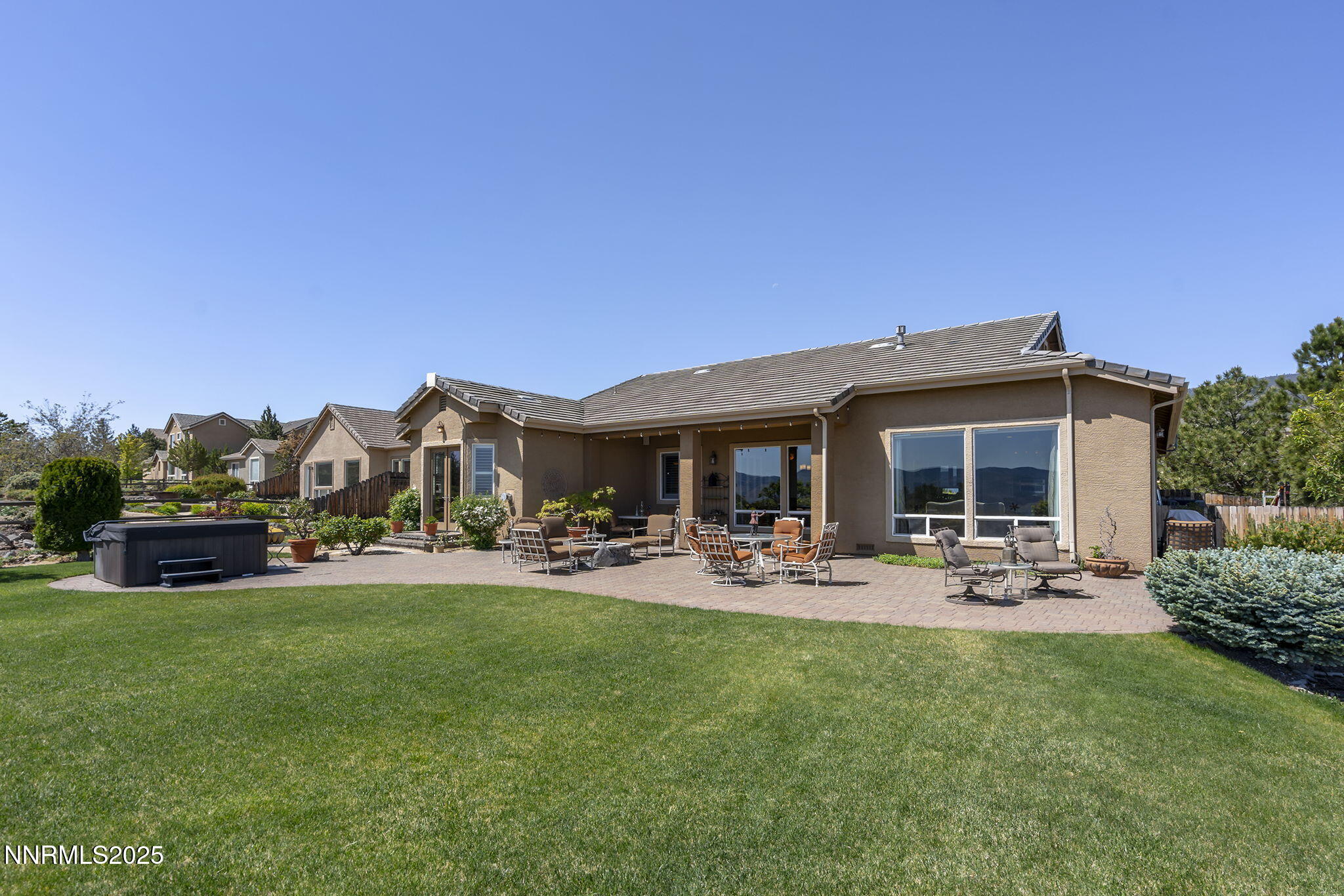 2698 Wind Feather Trail Reno, NV 89511 - Photo 2 of 44 a view of a house with patio and a garden