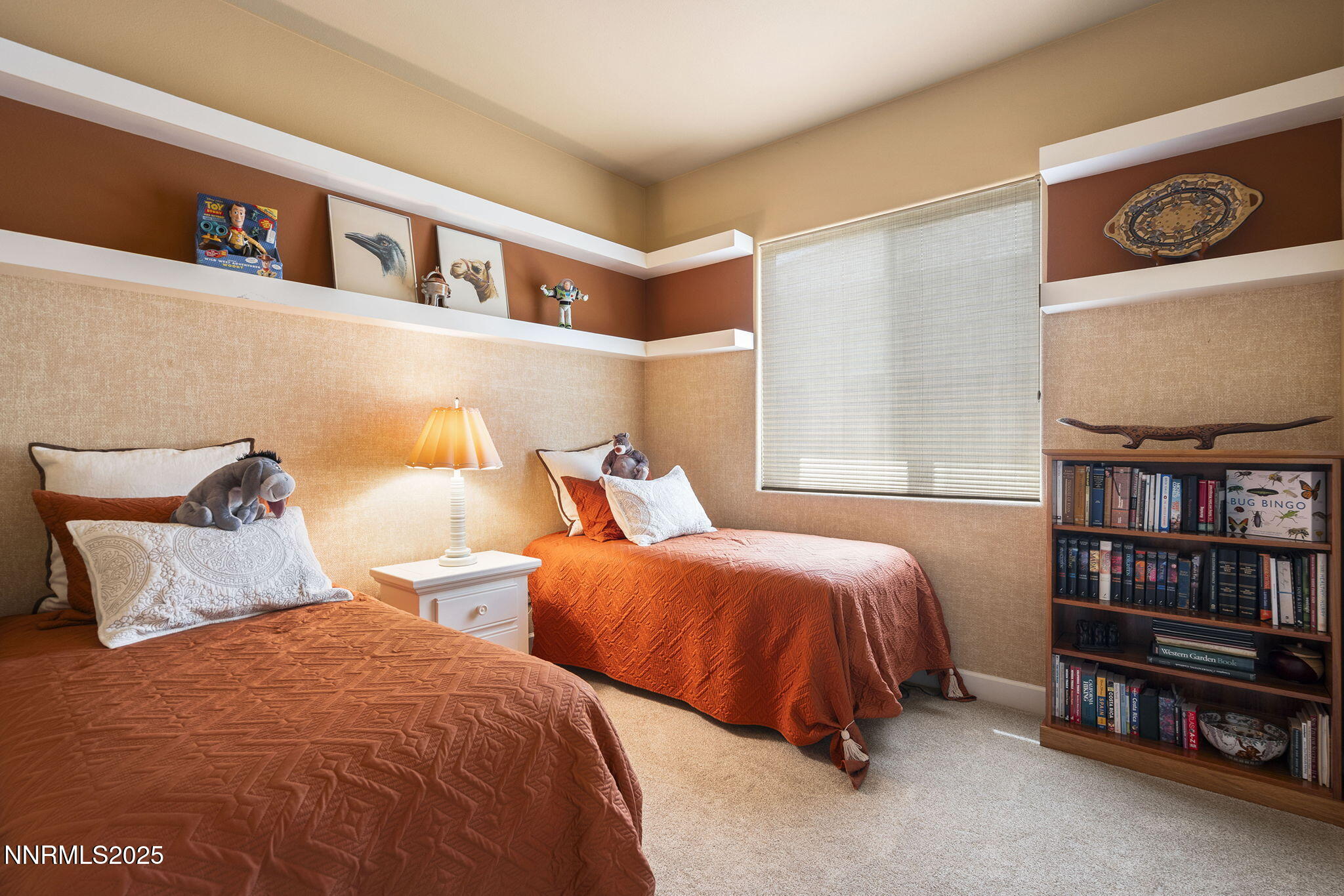 2698 Wind Feather Trail Reno, NV 89511 - Photo 21 of 44 a bedroom with two beds and a shelf